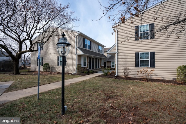 view of side of property featuring a yard