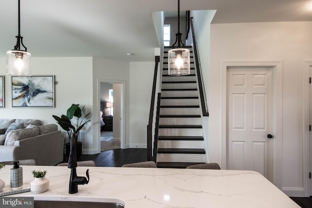 stairway with hardwood / wood-style flooring