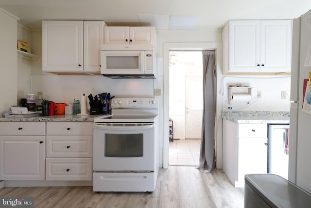 kitchen with white cabinetry, light stone countertops, light wood-type flooring, and white appliances