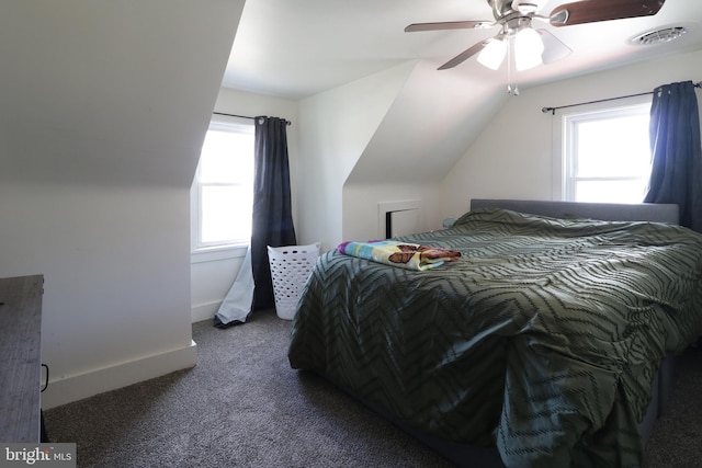 carpeted bedroom featuring lofted ceiling and ceiling fan