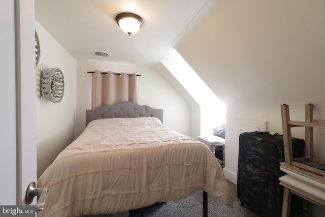 bedroom with carpet and lofted ceiling