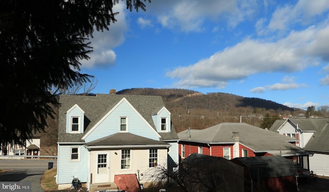 back of property featuring a mountain view