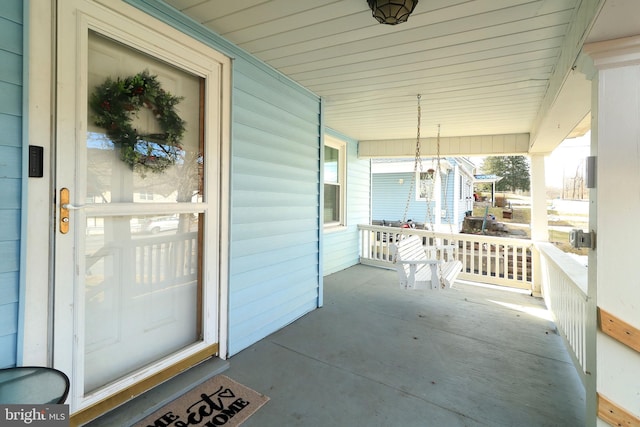 property entrance featuring a porch