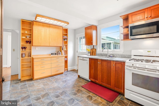 kitchen featuring sink and white appliances