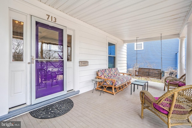 wooden deck with a porch