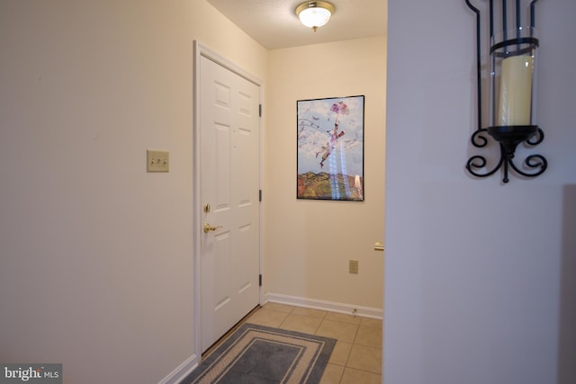 entryway featuring light tile patterned floors