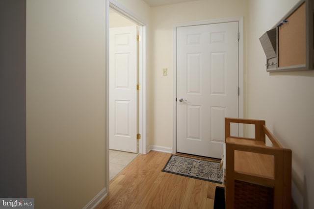 entryway with light hardwood / wood-style floors