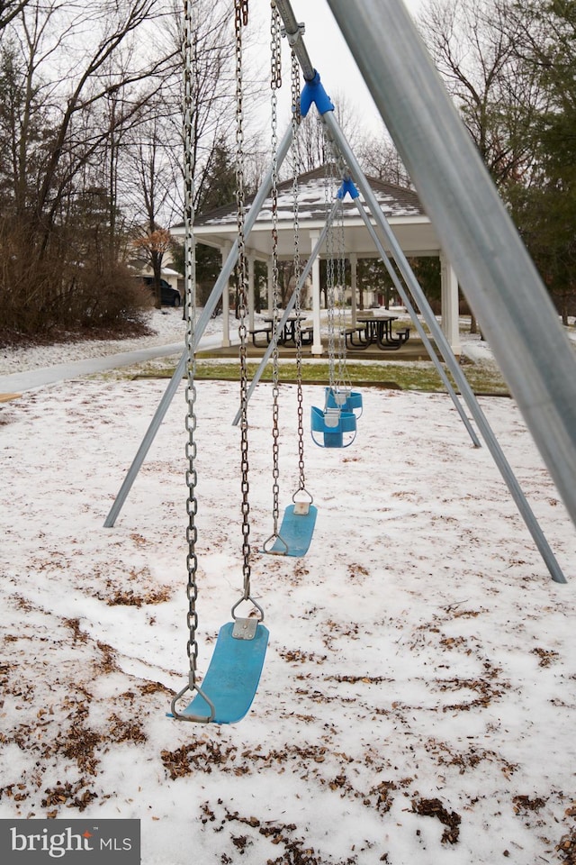 snow covered pool featuring a playground