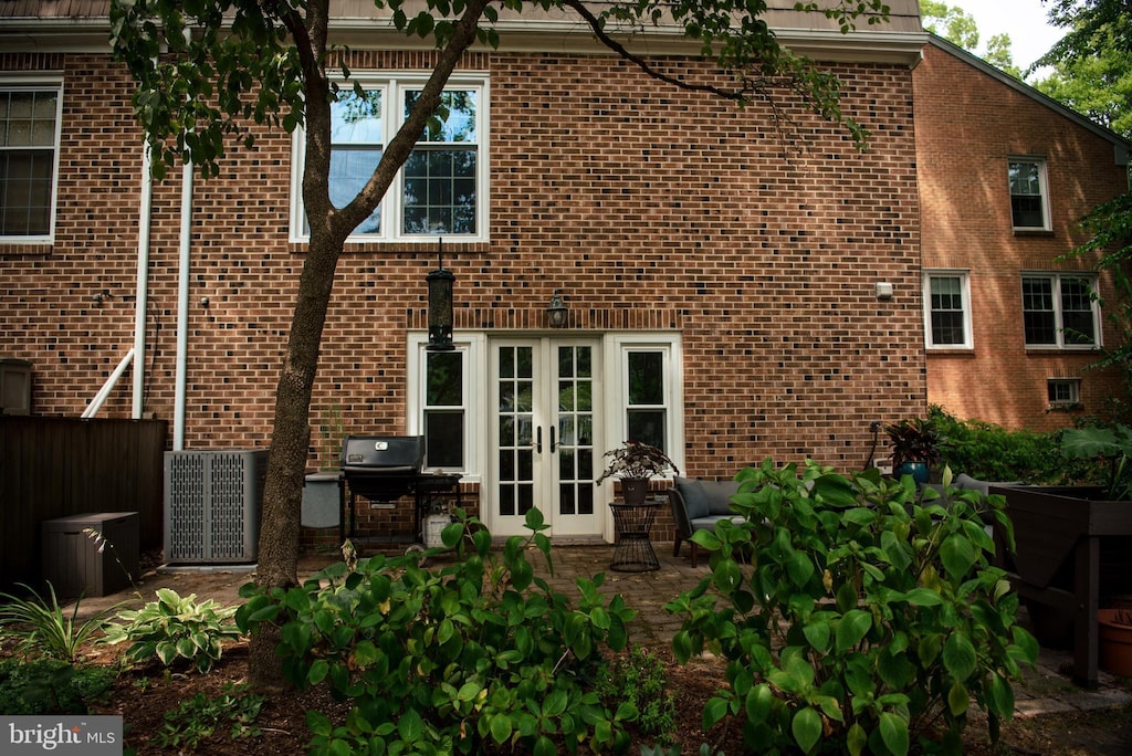 back of house featuring a patio and french doors