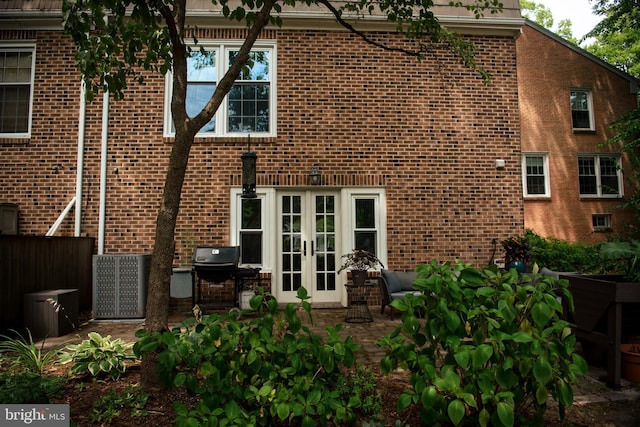 back of house featuring a patio and french doors