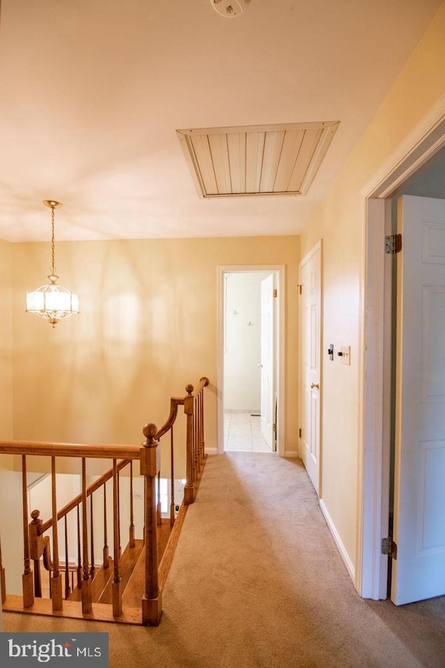 hallway featuring light carpet