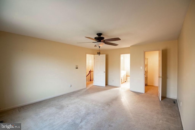 unfurnished bedroom with ceiling fan and light carpet