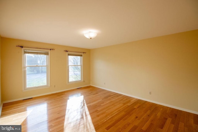 unfurnished room featuring light hardwood / wood-style flooring