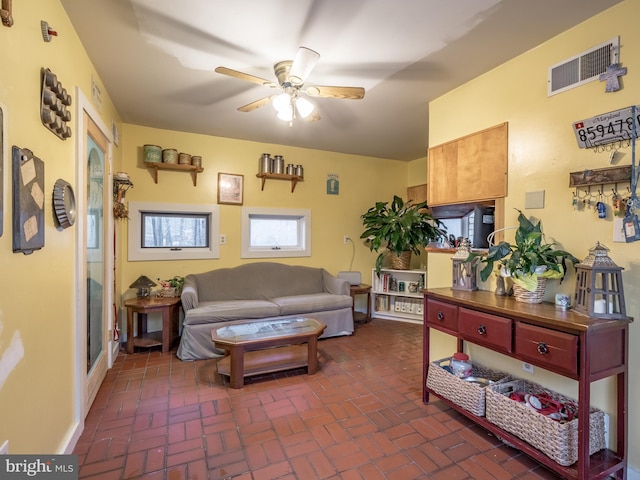 living room with ceiling fan