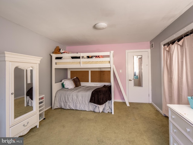 bedroom featuring light carpet