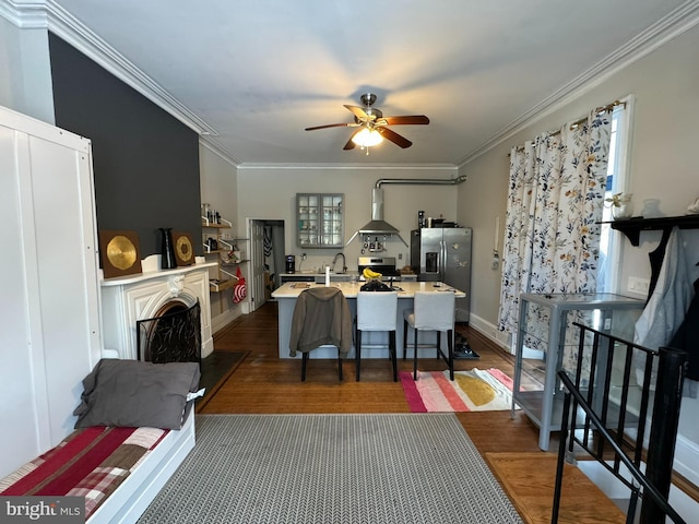 living room featuring crown molding, sink, ceiling fan, and dark hardwood / wood-style flooring