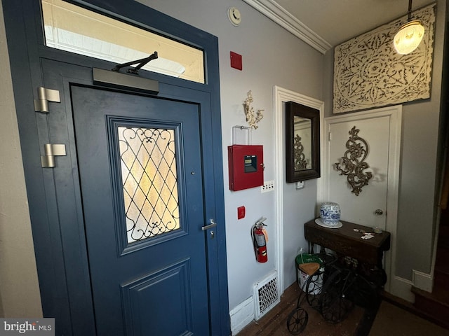 interior space with crown molding