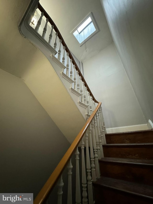 stairs with high vaulted ceiling