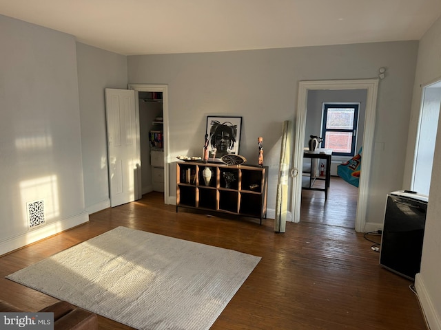 interior space with dark hardwood / wood-style floors