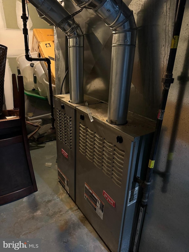 utility room featuring heating unit