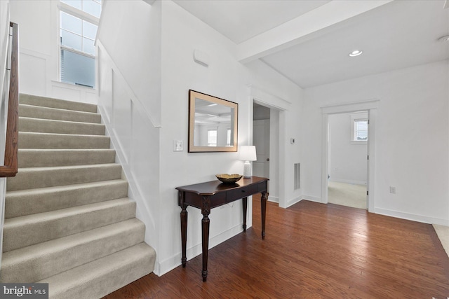 entrance foyer featuring baseboards, stairway, beamed ceiling, recessed lighting, and dark wood-style flooring