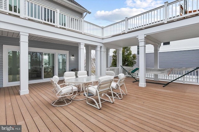 deck with outdoor dining area