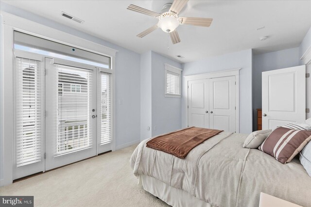 bedroom featuring visible vents, access to outside, carpet floors, baseboards, and ceiling fan