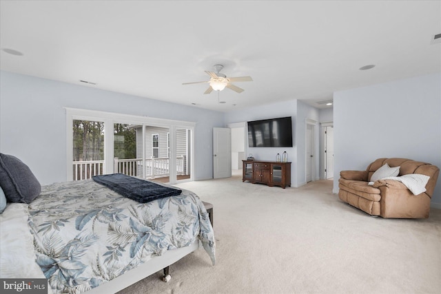 carpeted bedroom featuring access to exterior, visible vents, and ceiling fan