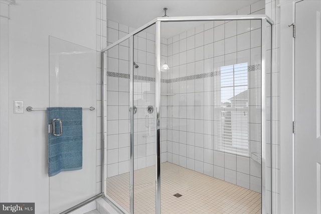 bathroom with a stall shower