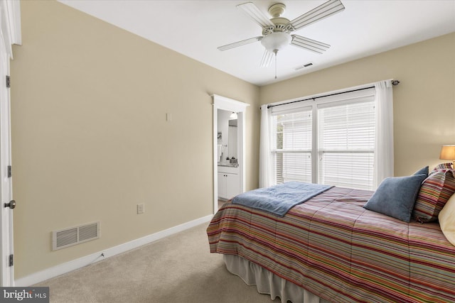 bedroom featuring visible vents, baseboards, carpet, and ensuite bathroom