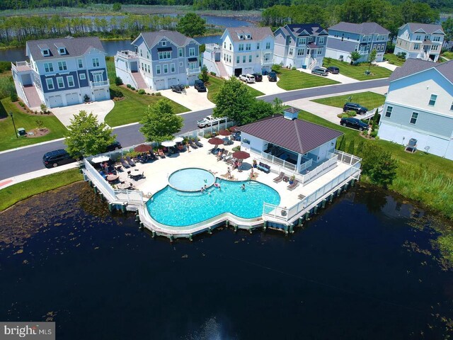 aerial view featuring a residential view and a water view