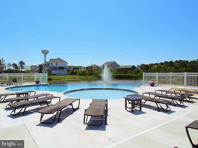 pool featuring a patio and fence