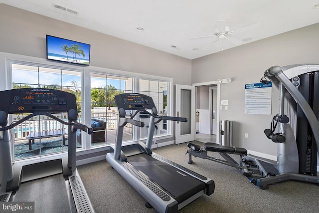 gym featuring visible vents, baseboards, and ceiling fan