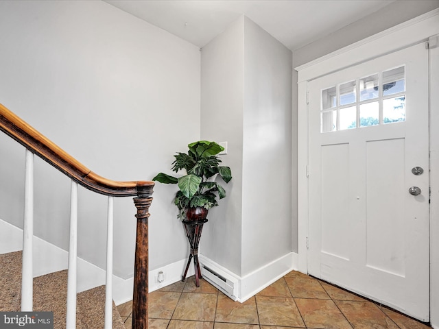 tiled entryway with baseboard heating