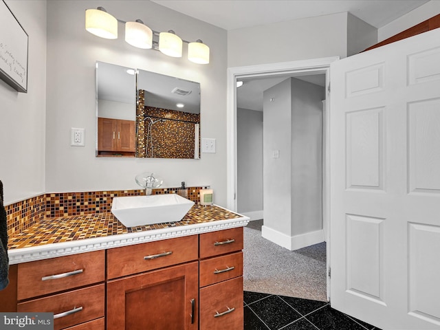 bathroom featuring tasteful backsplash and vanity