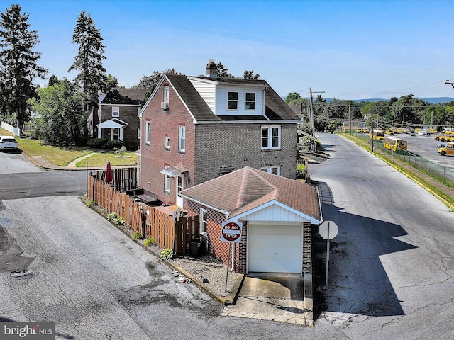 view of front of property with a garage