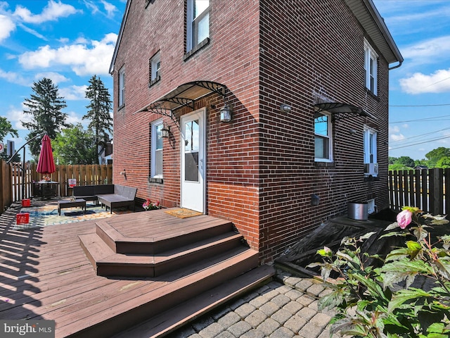 view of home's exterior featuring a wooden deck