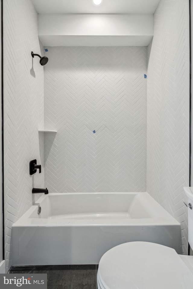 bathroom with toilet and shower / washtub combination