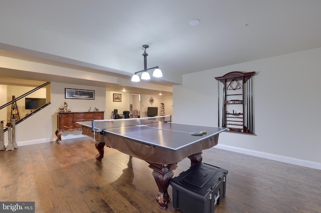 rec room featuring dark wood finished floors and baseboards