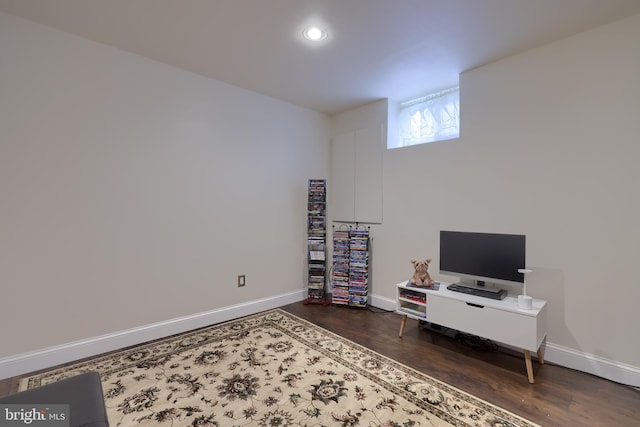 interior space featuring recessed lighting, wood finished floors, and baseboards