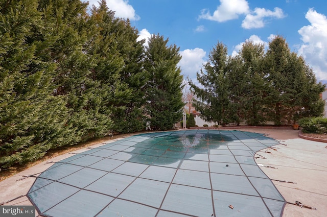 view of pool featuring a covered pool and a patio