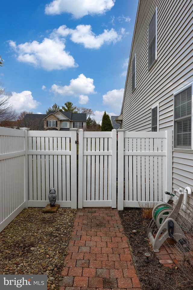 view of patio / terrace with a fenced backyard and a gate