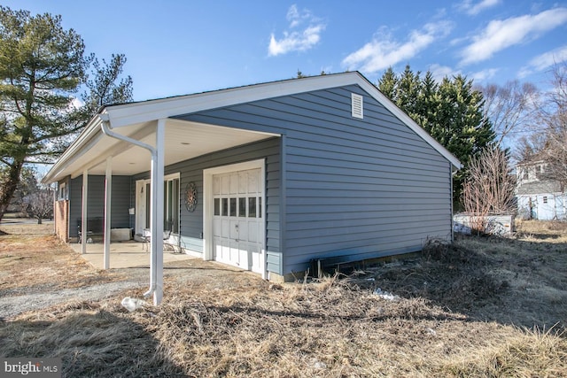 view of side of property with a garage