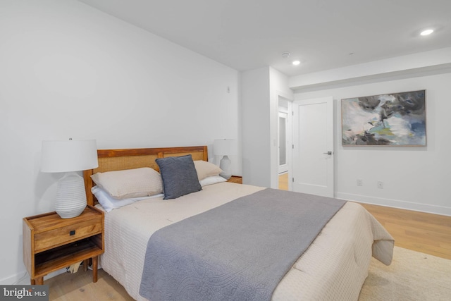 bedroom with light hardwood / wood-style floors