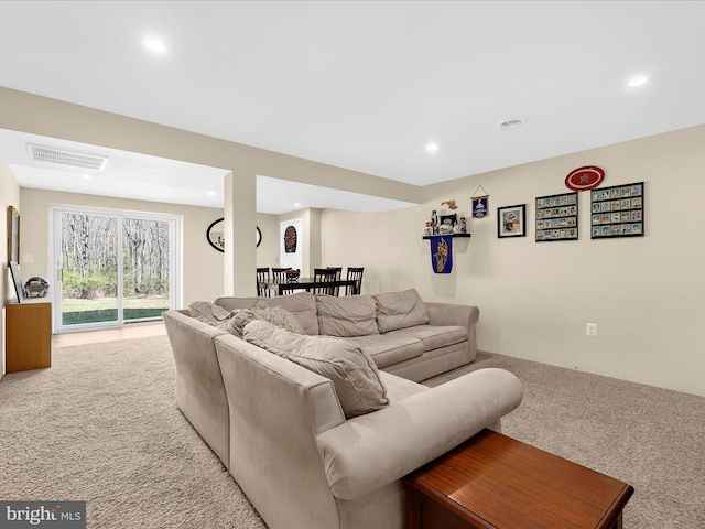 living area with visible vents, carpet floors, and recessed lighting