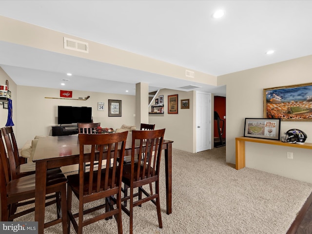 dining area with light carpet, visible vents, and recessed lighting