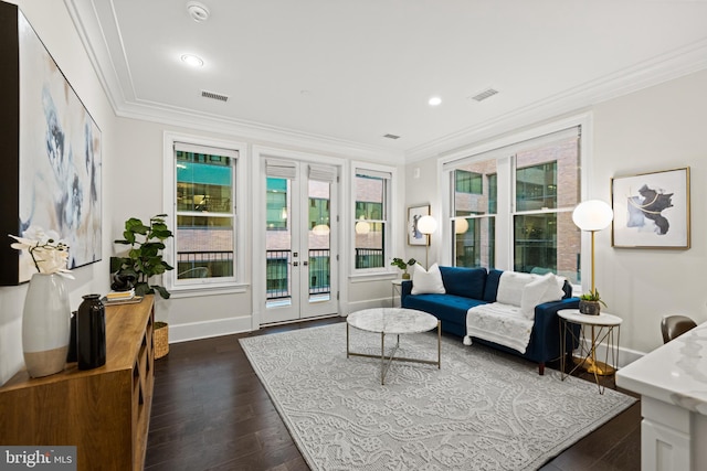 interior space featuring visible vents, baseboards, french doors, ornamental molding, and dark wood finished floors