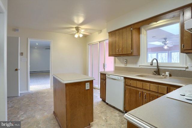 kitchen with sink, ceiling fan, dishwasher, and a kitchen island