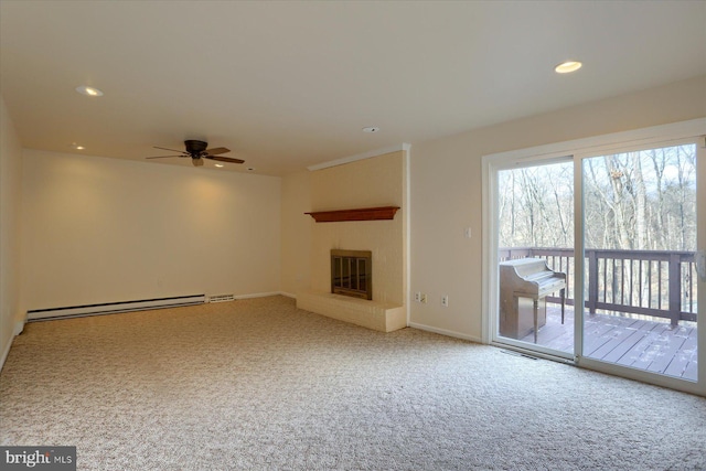 unfurnished living room featuring ceiling fan, carpet floors, and baseboard heating