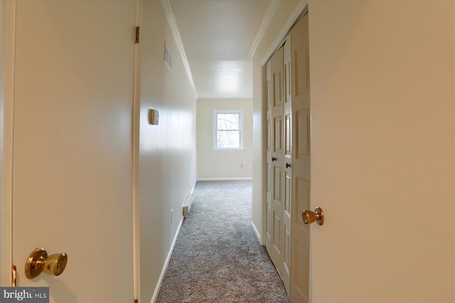 corridor featuring ornamental molding and light colored carpet